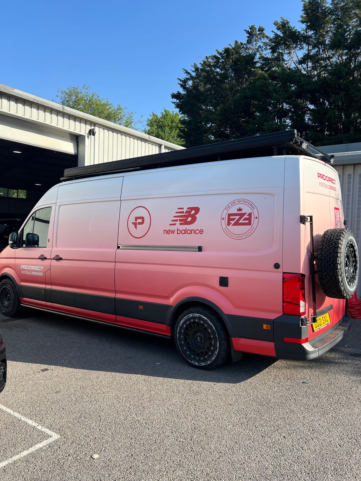 Pro:Direct and New Balance van in a white to red fade wrap