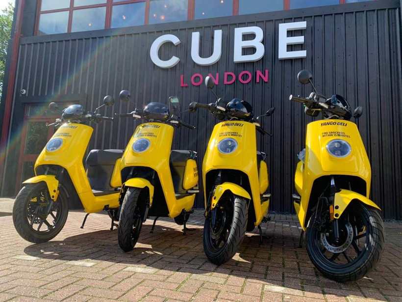 Yellow delivery moped fleet wrap
